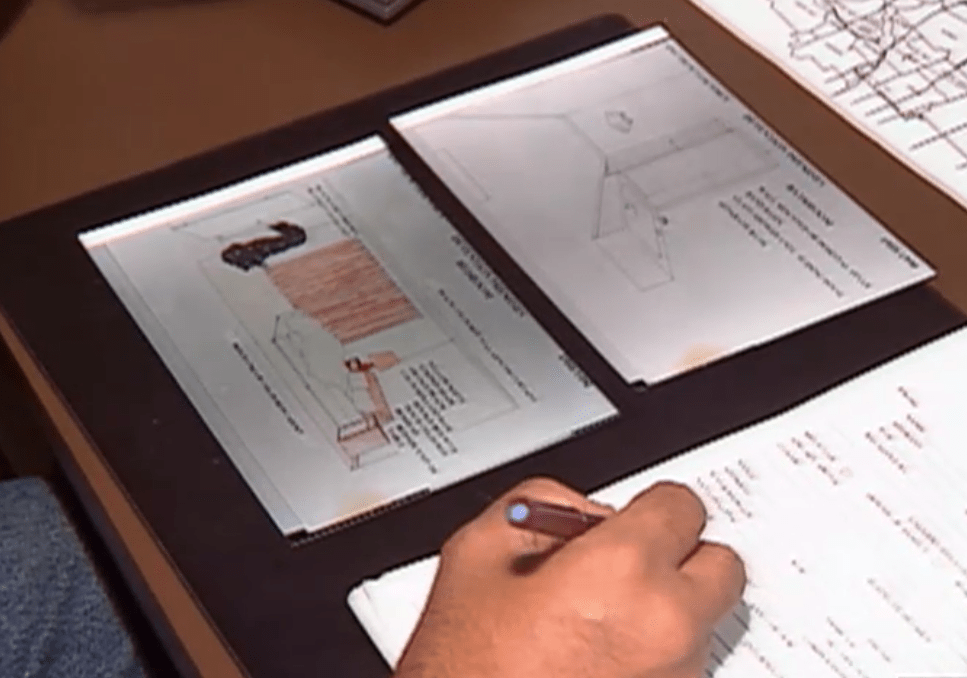 A detective takes notes whilst receiving a tip off about the investigation 30 January 1993.